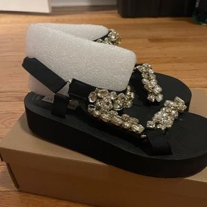 Embellished platform sandals.
